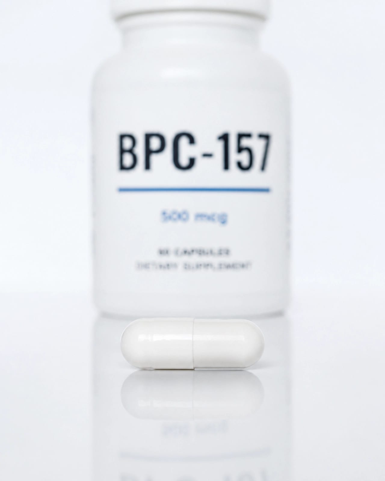 A single BPC-157 capsule on a pristine white surface, representing purity and clinical precision.